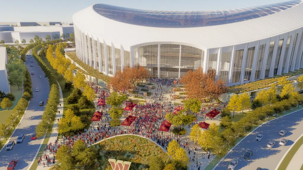 Washington Commanders Stadium - Aerial East Plaza_courtesy OJB Aerial view of the Washington Commanders stadium east plaza, with tree-lined approaches and fan gatherings in a public realm landscape designed by OJB.